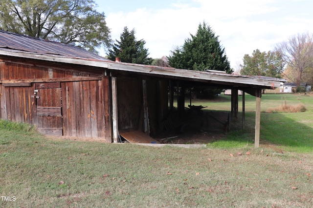 view of outdoor structure featuring a yard