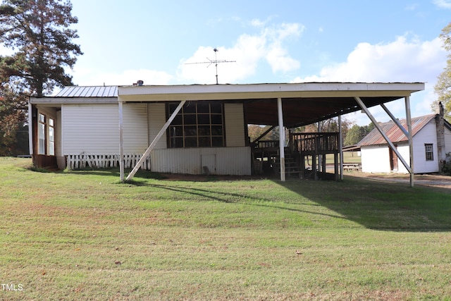 back of house featuring a yard