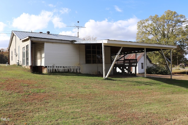 rear view of house with a yard