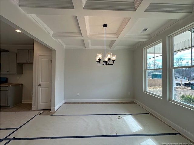 unfurnished dining area featuring coffered ceiling, beam ceiling, crown molding, and a chandelier