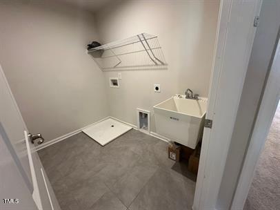 washroom with washer hookup, sink, and electric dryer hookup