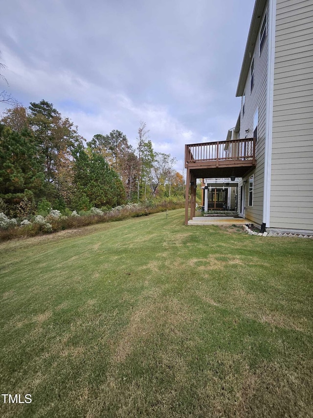 view of yard featuring a deck