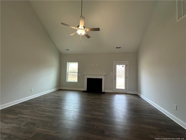 unfurnished living room featuring dark wood-style floors, a fireplace with flush hearth, visible vents, and ceiling fan