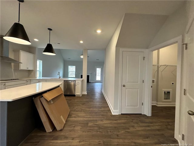 kitchen featuring light countertops, black electric stovetop, white cabinetry, and stainless steel dishwasher