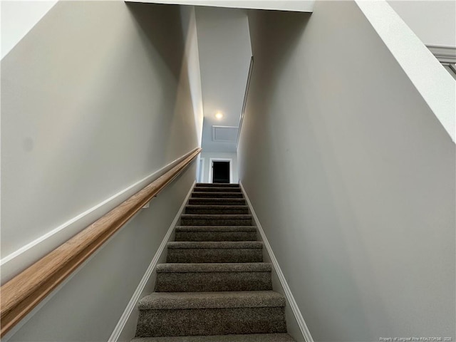 stairs featuring baseboards