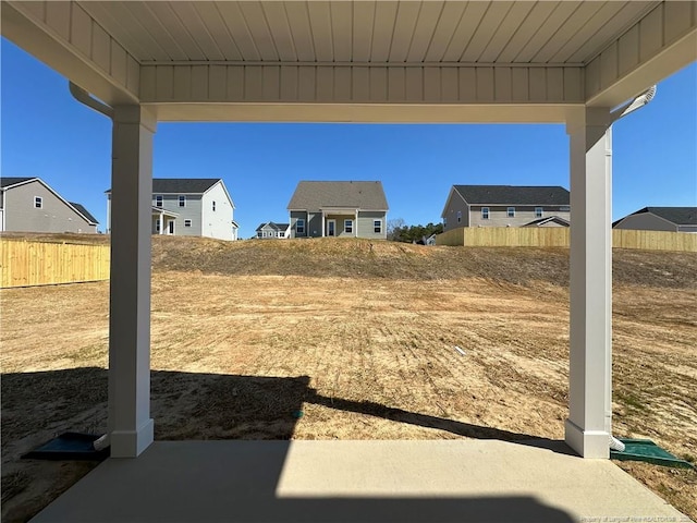 view of yard featuring a residential view and fence