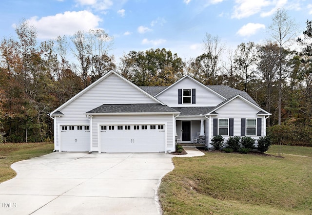 view of front of property featuring a garage and a front yard