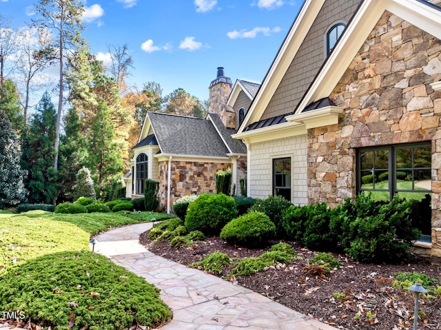 view of home's exterior with a yard