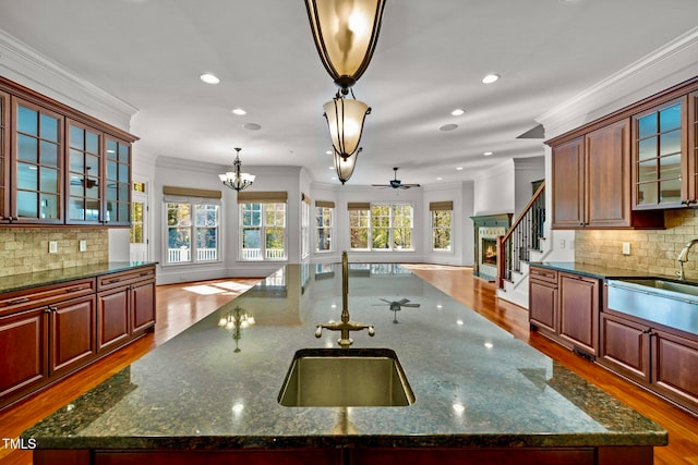 kitchen featuring a large island, hardwood / wood-style flooring, and plenty of natural light