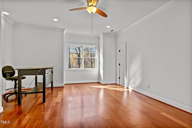 office space with light wood-type flooring, ceiling fan, and ornamental molding