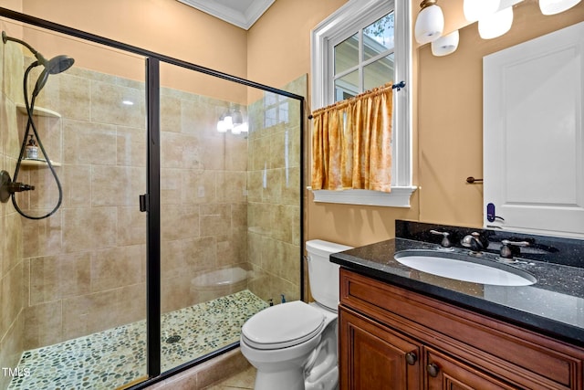 bathroom with walk in shower, vanity, toilet, and crown molding