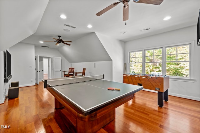 recreation room featuring ceiling fan, light hardwood / wood-style flooring, and lofted ceiling