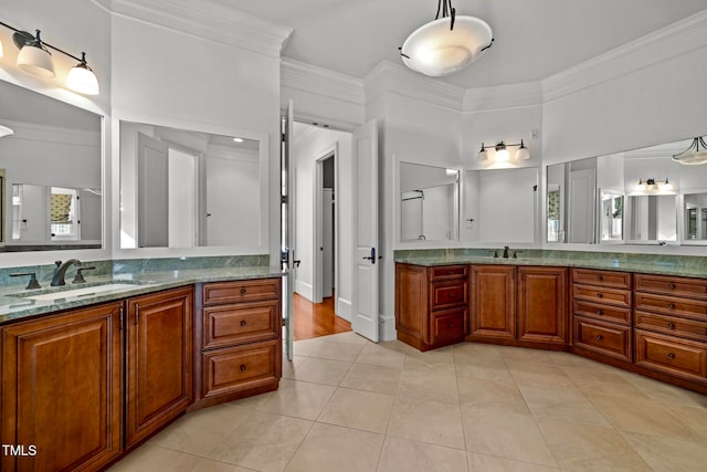 bathroom featuring vanity, tile patterned flooring, and ornamental molding