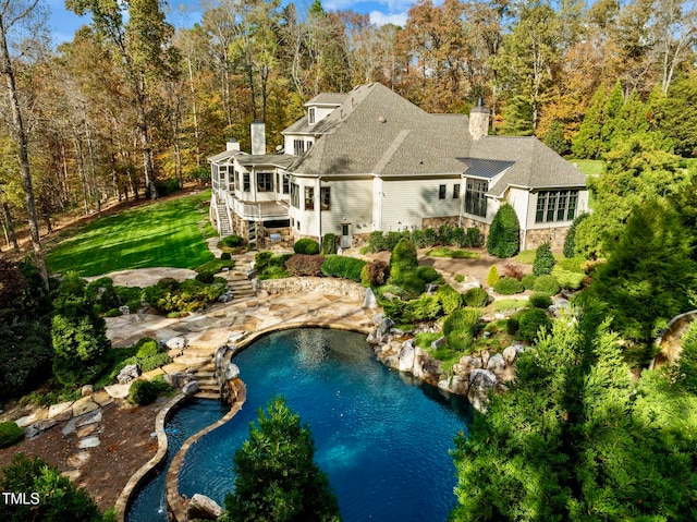 view of swimming pool with a patio and a wooden deck