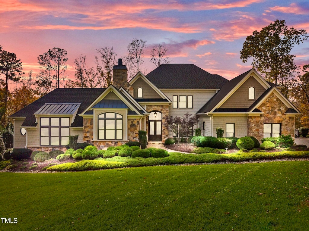 view of front of home with a lawn