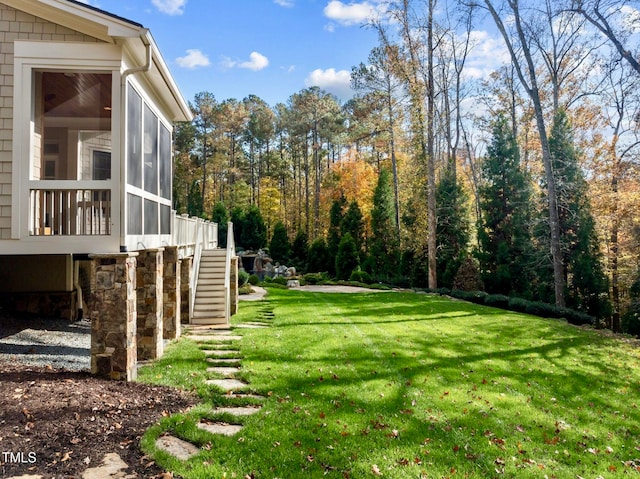 view of yard with a sunroom