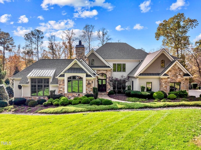 craftsman-style home featuring a front yard