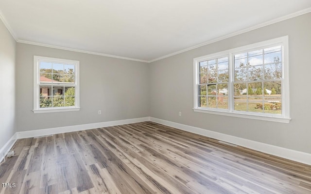 203 W Stewart St, Coats, NC 27521 - empty room with crown molding, baseboards, and wood finished floors