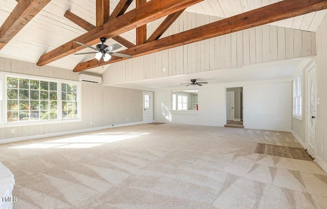 unfurnished living room featuring light colored carpet, vaulted ceiling with beams, wooden walls, ceiling fan, and an AC wall unit