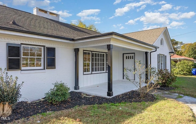 view of home's exterior with a lawn