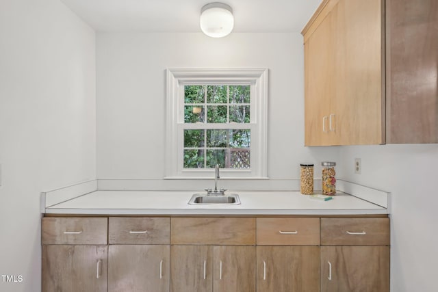 1316 Glenwood Ave, Raleigh, NC 27605 - kitchen with a sink, light brown cabinetry, and light countertops