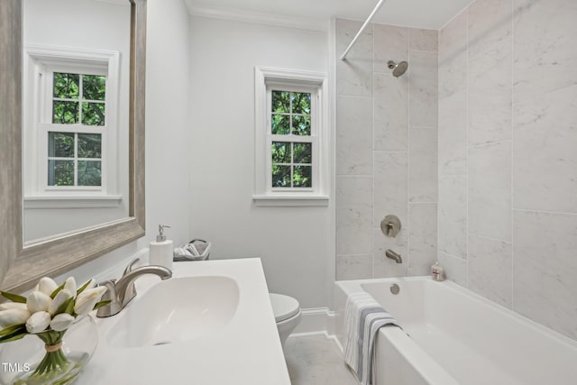 1316 Glenwood Ave, Raleigh, NC 27605 - bathroom featuring vanity, toilet, baseboards, shower / bathing tub combination, and ornamental molding