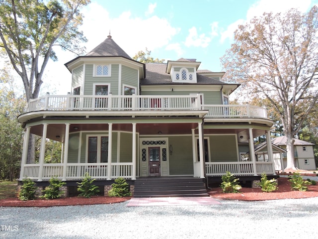 victorian-style house featuring a porch