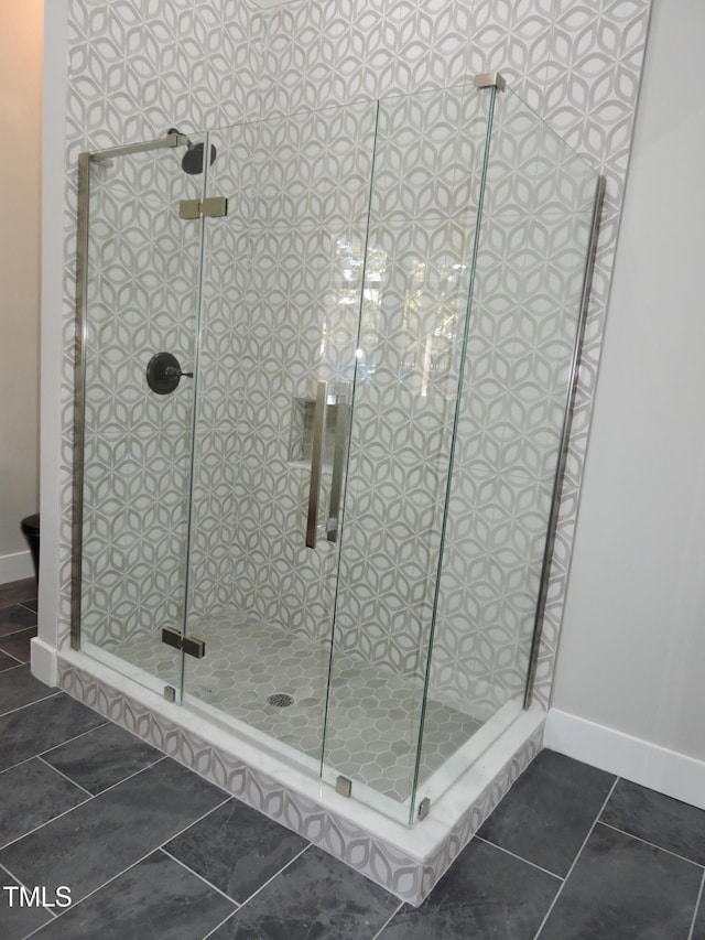 bathroom with tile patterned flooring and an enclosed shower