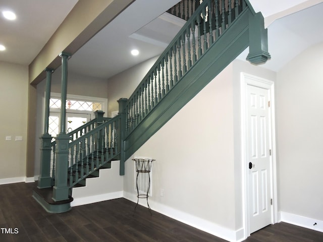 stairway featuring hardwood / wood-style floors