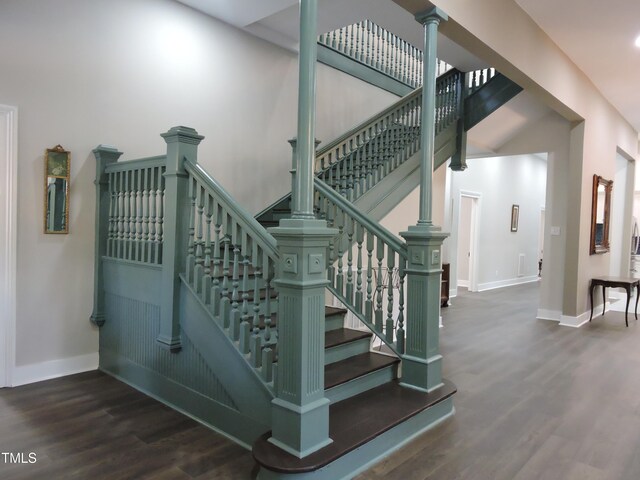 staircase with wood-type flooring