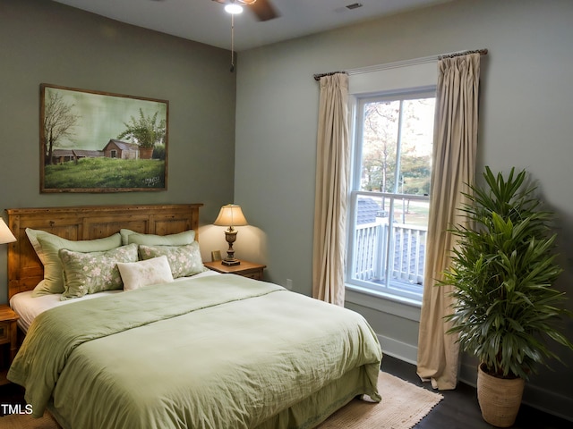 bedroom with wood-type flooring and ceiling fan