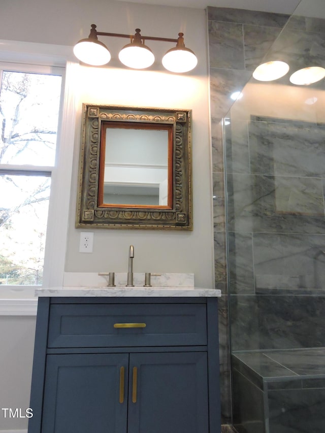 bathroom featuring vanity and a healthy amount of sunlight