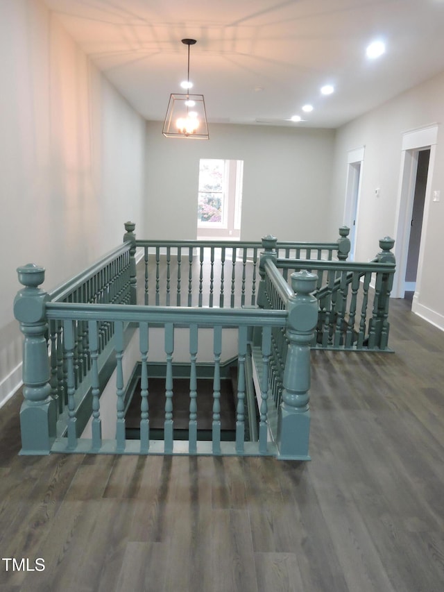 stairs featuring hardwood / wood-style flooring