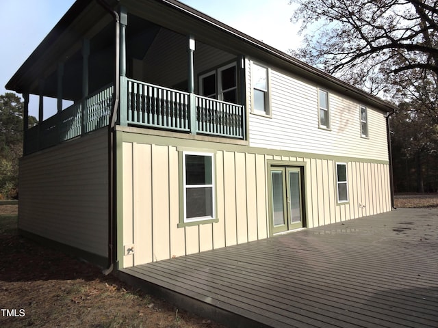 view of side of home with a balcony