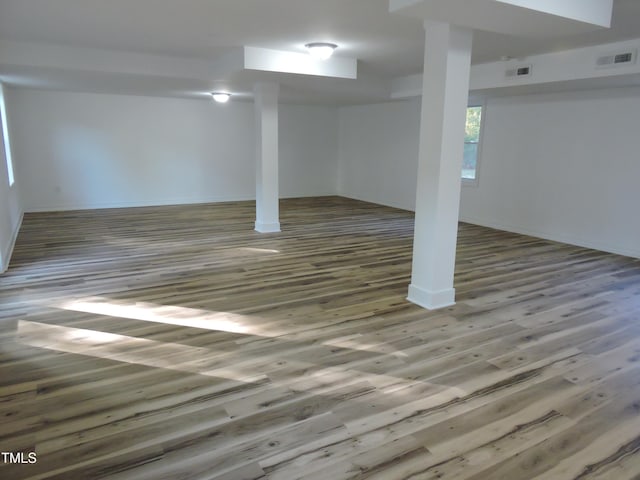 basement featuring dark wood-type flooring