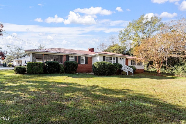 ranch-style home featuring a front yard