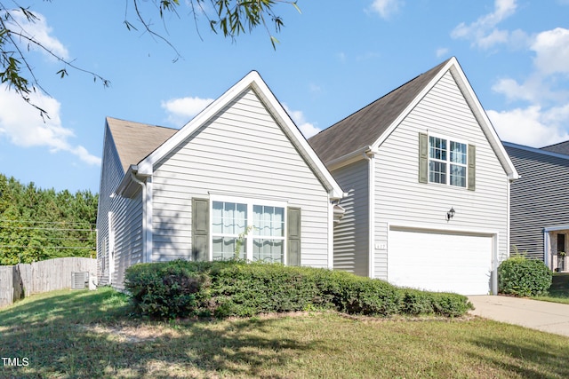 view of front of property featuring a garage and a front yard