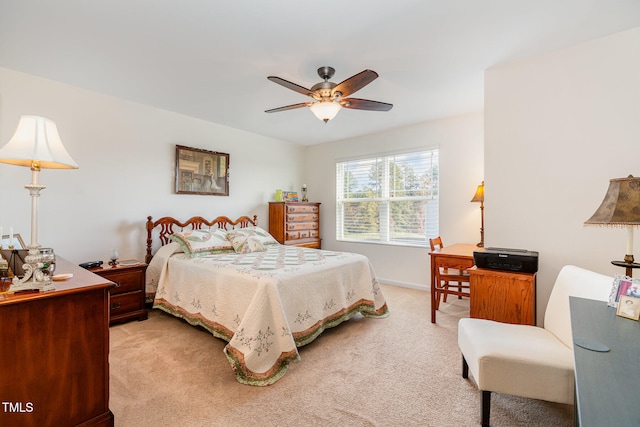 bedroom with baseboards, light colored carpet, and a ceiling fan