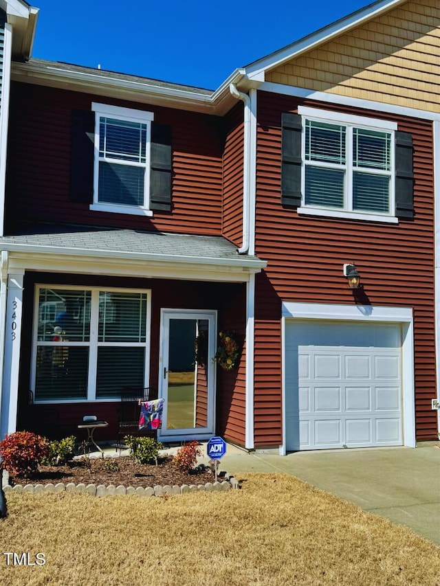 view of front facade with an attached garage and driveway