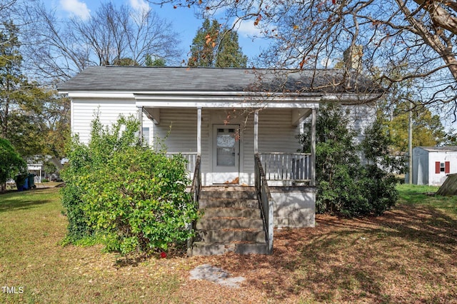 view of front of house featuring a front lawn and a porch