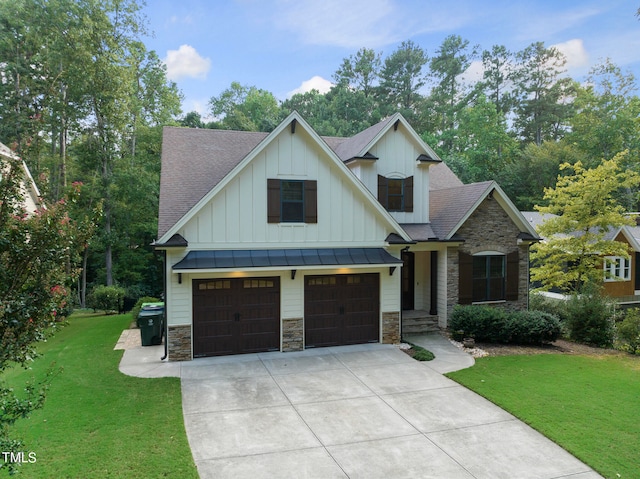 view of front of home with a garage and a front yard