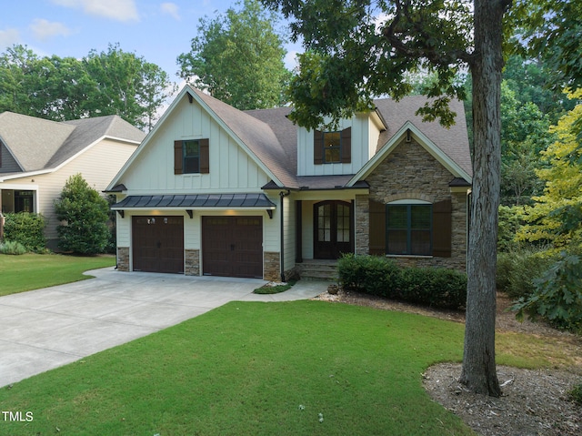 craftsman inspired home featuring a garage and a front yard