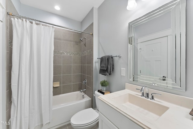 full bathroom featuring toilet, vanity, and shower / bathtub combination with curtain