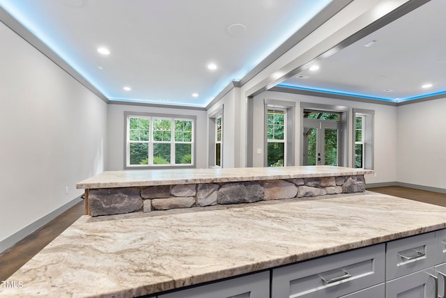 interior space featuring hardwood / wood-style flooring and crown molding