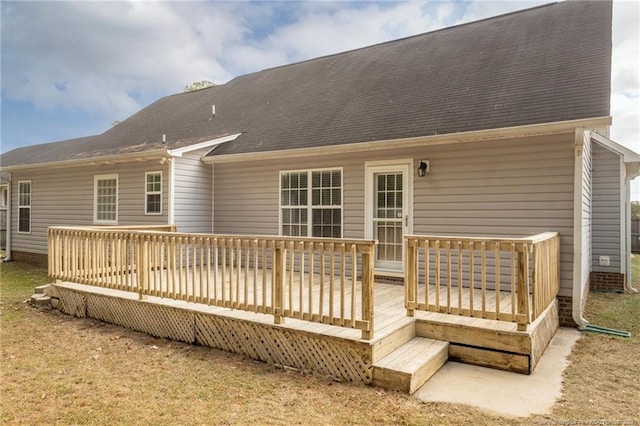 rear view of house with a wooden deck