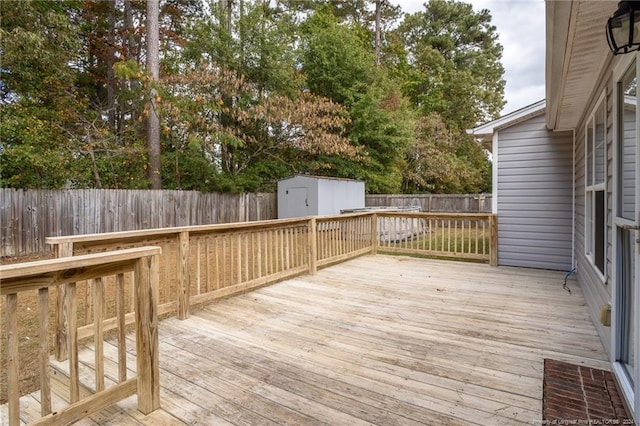 wooden deck with a storage shed