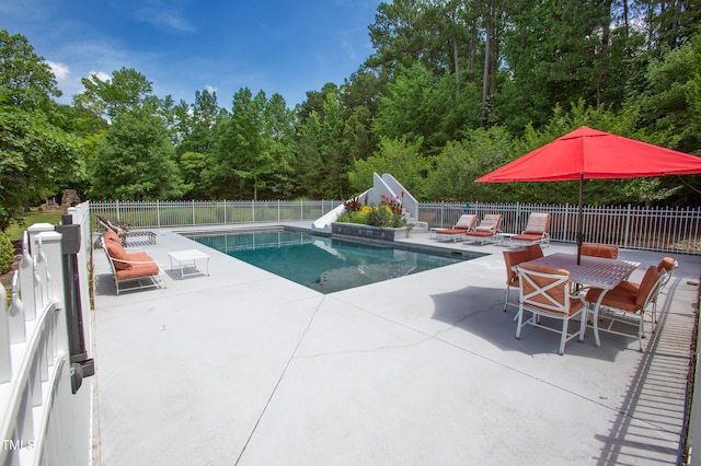 view of swimming pool with a patio area