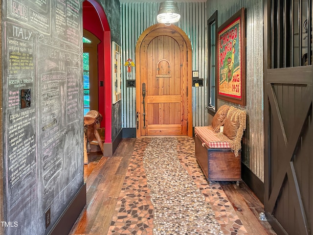 entryway with dark hardwood / wood-style flooring