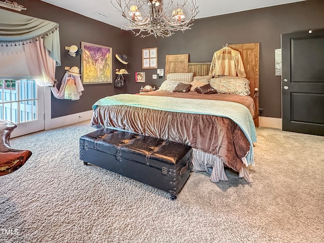 bedroom with carpet floors and a notable chandelier