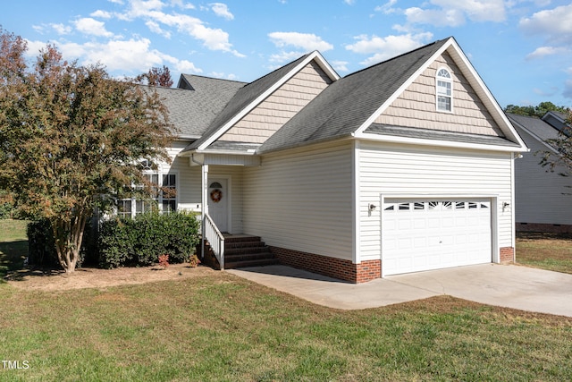 view of front of house featuring a garage and a front yard